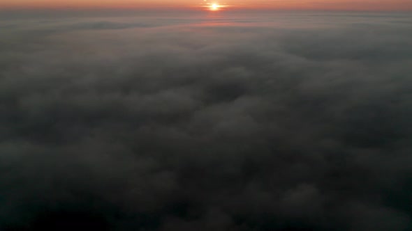 Video over а morning calm sea with low clouds alt