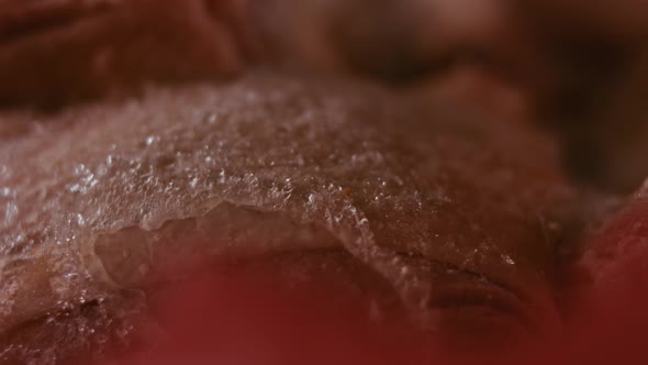 Closeup View of Hands in Gloves Packing Chicken Legs From a Box Into Individual Plastic Bags