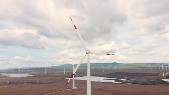 Alternative energy production on the wind power station with windmills