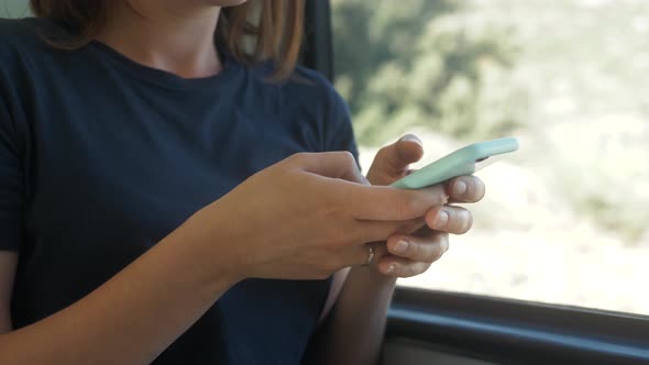 Enjoying Travel Tourist Concept. Young Pretty Woman Tourist Traveling By the Train or Bus Sitting