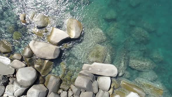 Beautiful seashore rocks in Phuket ocean Sea waves crashing on rocks cliff