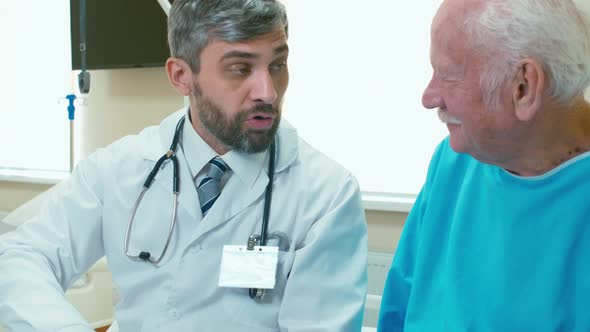 Doctor talking about diagnosis with old patient