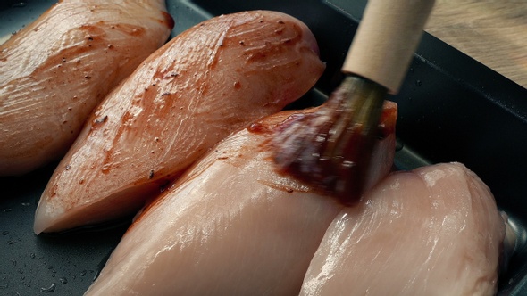 Chicken Breasts Basted And Taken Off For Cooking