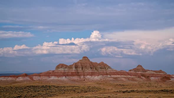 Time lapse of clouds moving over red desert landscape in Wyoming