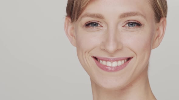 Studio portrait of young, beautiful and natural blond woman.