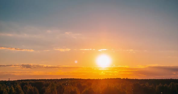 Sunset with Rays Through the Clouds on the Horizon of the Sky