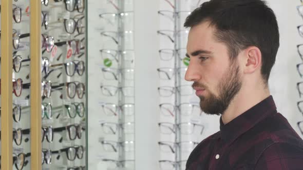 Young Man Taking Photos of Glasses at the Eyewear Store