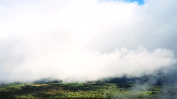 Aerial view up from the clouds to the sky in motion