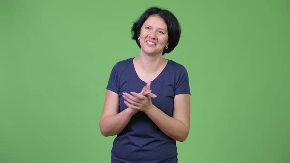 Beautiful Happy Woman with Short Hair Clapping Hands