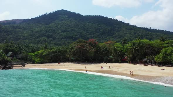 Aerial flying over sky of paradise sea view beach trip by blue green sea and white sand background o