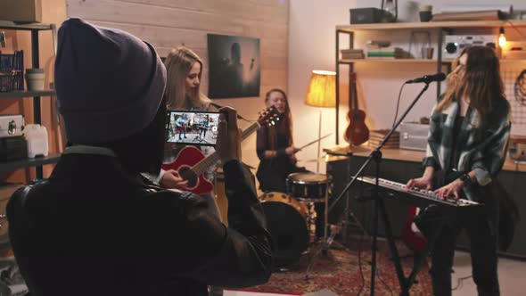 Filming Video Of Female Rock Group Performance