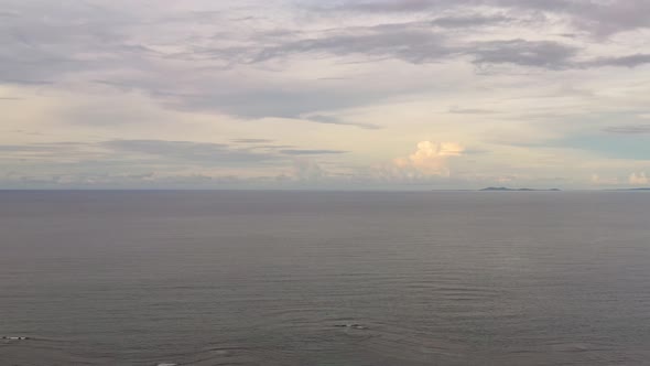 Seascape in the Evening. Calm Sea and Island.