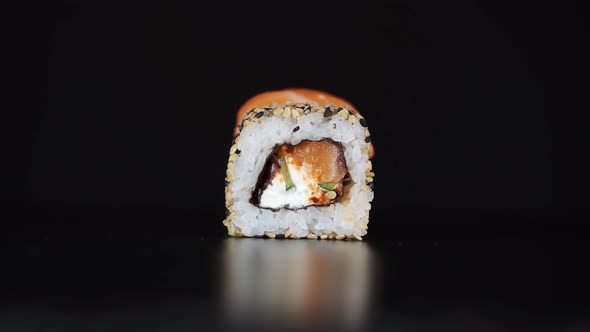 The Different Type of Sushi Roll Is Lifted Up with Chopsticks in Sequence.