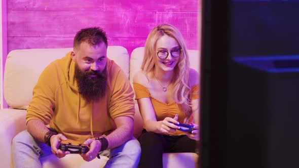 Beautiful Blonde Girl Smiling While Playing Video Games