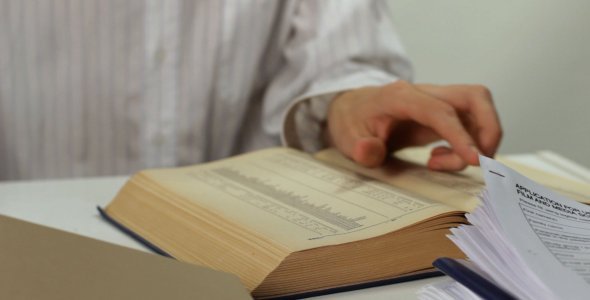 Man Working with Papers at the Table - 01