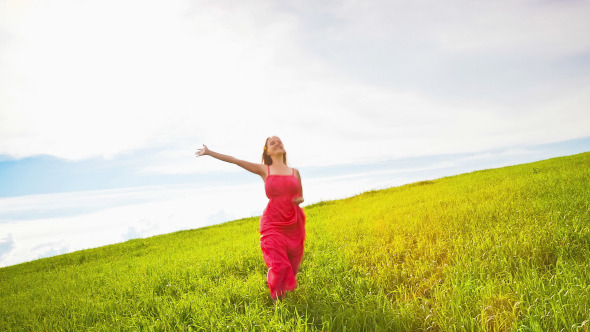 Woman Runs Across the Meadow