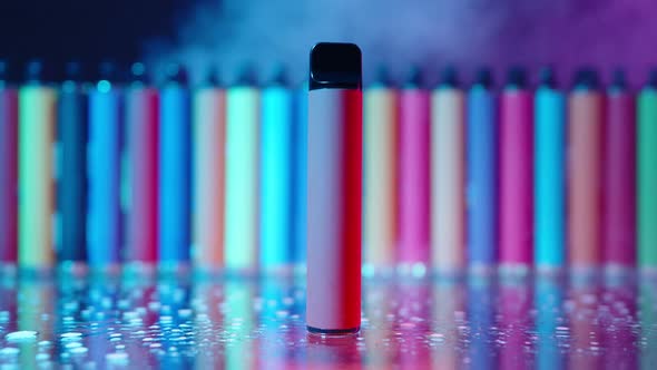 ECigarettes and Vapes with Smoke in Neon Lighting