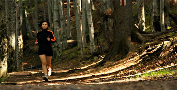 Girl Running In Forest