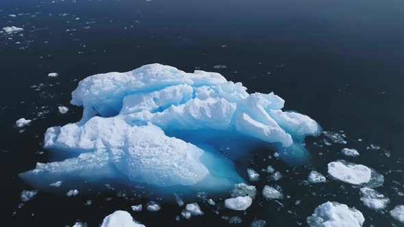 Aerial Flight Over Iceberg in Antarctica Ocean.