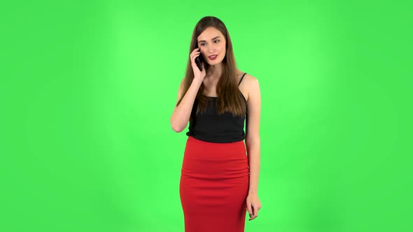 Girl Talking for Mobile Phone, Very Shocked Then Rejoice. Green Screen