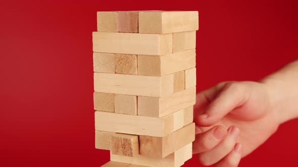 Jenga Game on Red Background