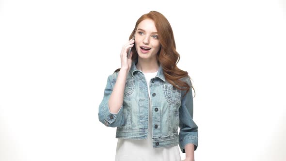 Young Caucasian Woman Talking on Phone and Smiling. Beautiful Caucasian Young Female Professional