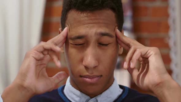 Tense African Man with Headache Pain in Head