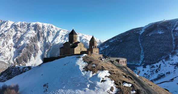 Aerial view of Gergeti Trinity Church, Tsminda Sameba in Kazbegi. Georgia 2022