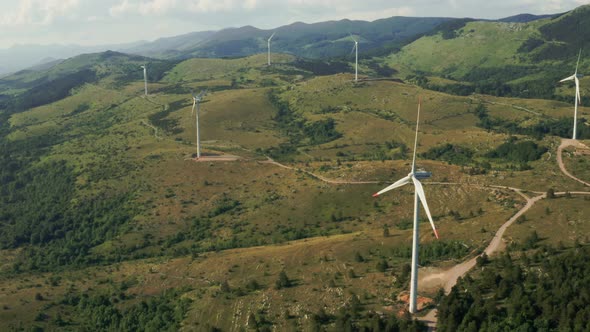 Aerial Footage From Drone Flying Over Wind Turbines