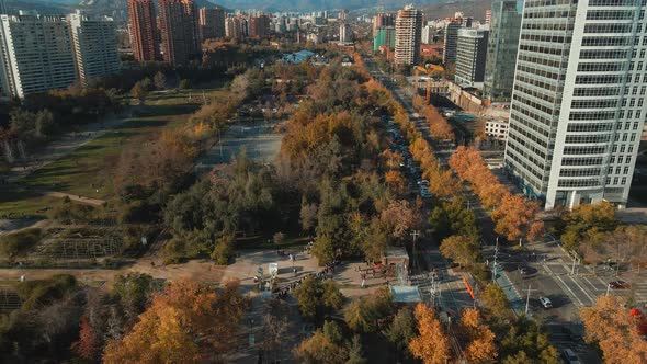 Santiago City Skyline Chile On A Sunny Day. Aerial View Of Araucano Park With Trees In Autumn Colors