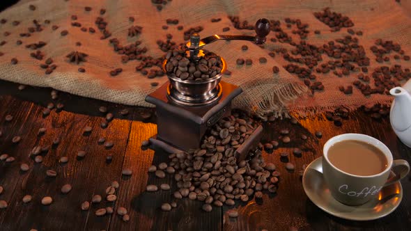 Cup with Latte and White Teapot on Wooden Table. Studio