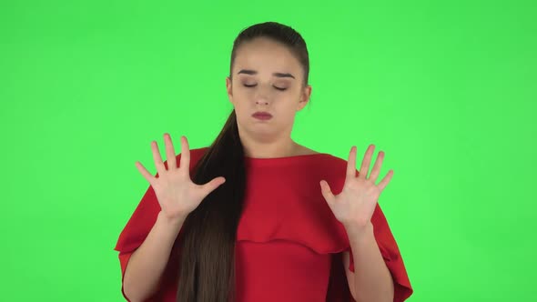 Portrait of Pretty Young Woman Is Relaxing, Meditating