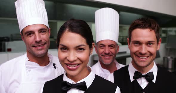 Cheerful Restaurant Staff Smiling at Camera