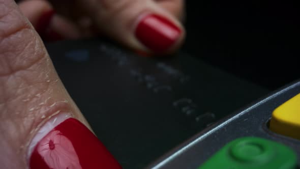 Woman Hand Using Credit Card Machine for Money Transaction. Payment Concept