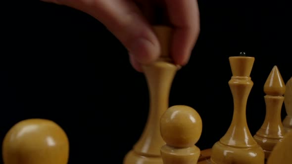 Chess Player Makes Rocking with White Wooden Chess Pieces