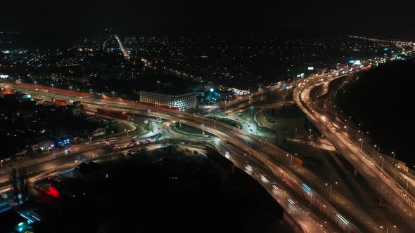 Aerial Drone Time Lapse Hyperlapse Car Traffic Roundabout Circle Interchange Road at Night Top View