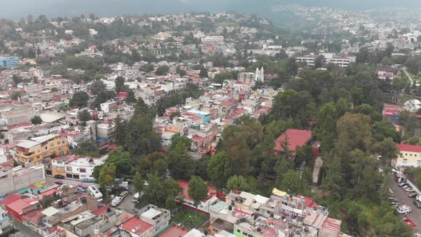 Aerial panoramic view of Barrio La Concepción at southern Mexico City. Drone flying forward and desc