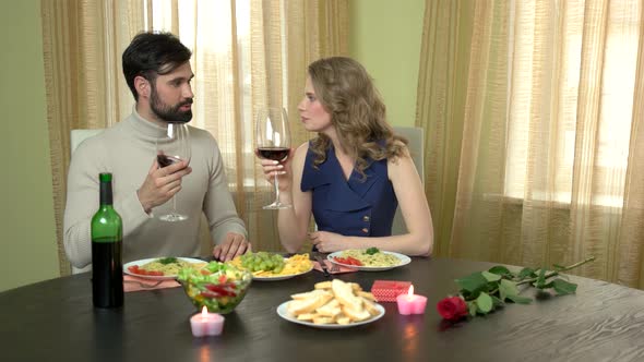 Man and Woman Drinking Wine