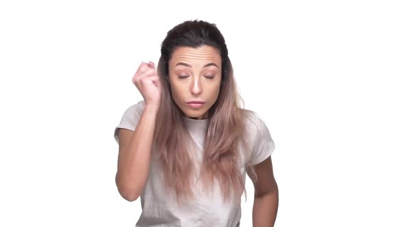 Portrait of Sassy Woman 20s in Casual Tshirt Holding Index Finger on Lips and Strongly Asking Not to