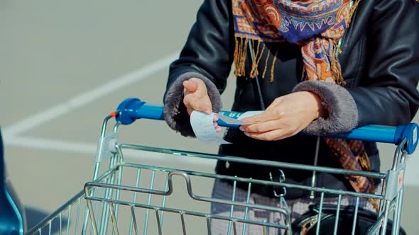 Female Checks Paper Receipt On shopping At Supermarket. Cash Register Money Spending On Hypermarket.