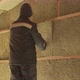 Man Laying Insulation in a Wall under Roof - VideoHive Item for Sale