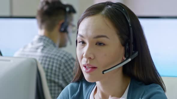Female Asian Call Centre Operator Working