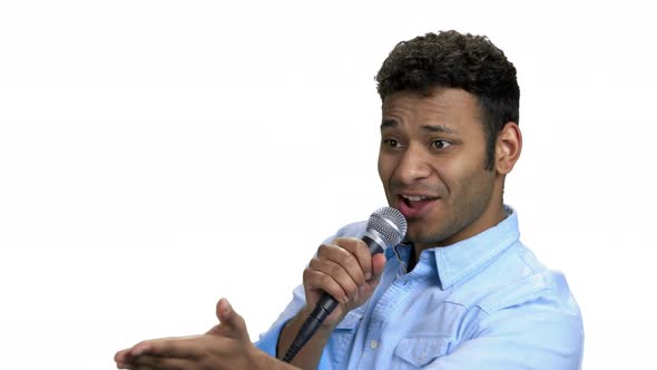 Energetic Entertainer Talking Into Microphone