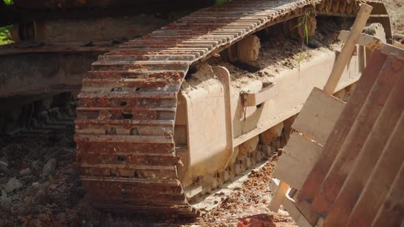 Excavator with Caterpillar Tracks at Demolition Site