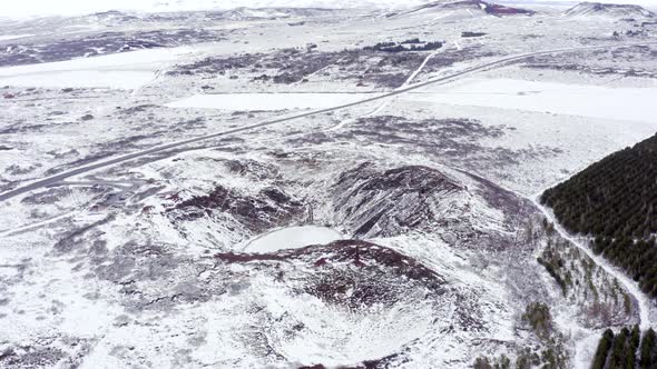 Snowy Volcanic Kerid Crater on the Golden Circle of Iceland Seen From the Air