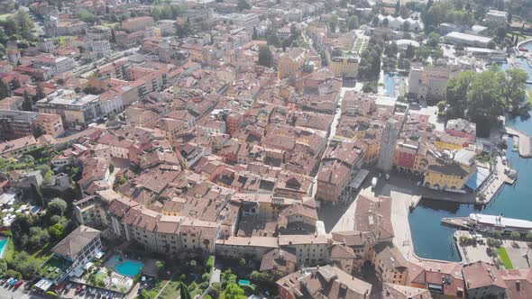 Aerial Shot of Downtown of Small Picturesque European City Near Big Lake in Sunny Weather, Camera Is