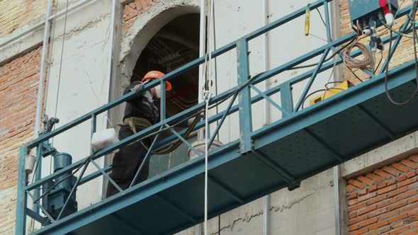 Industrial Workers Welding Metal Structures Male Welders Brazing a Steel Beam on a New Building at a