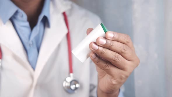 Doctor Hand Holding Artificial Sweetener Container