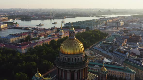 Golden Dome of Isaac Cathedral at Sunrise Aerial Morning Cityscape with Warship in the Neva River