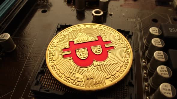 Gold Bit Coin BTC Coins on the Motherboard